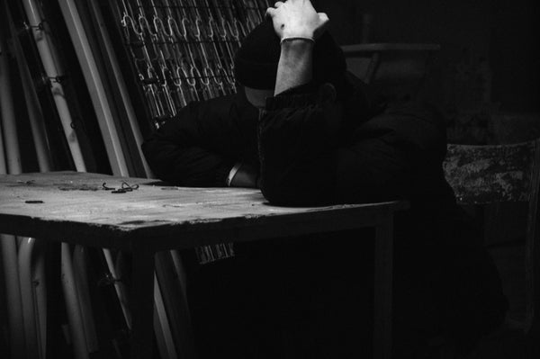 man experiencing emotional shutdown from brain fog or BPD episode, symbolizing genetic impact on mental health
