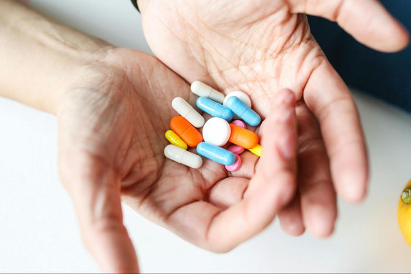 Supplements on table showing why nutrient absorption may fail | supplement absorption issues